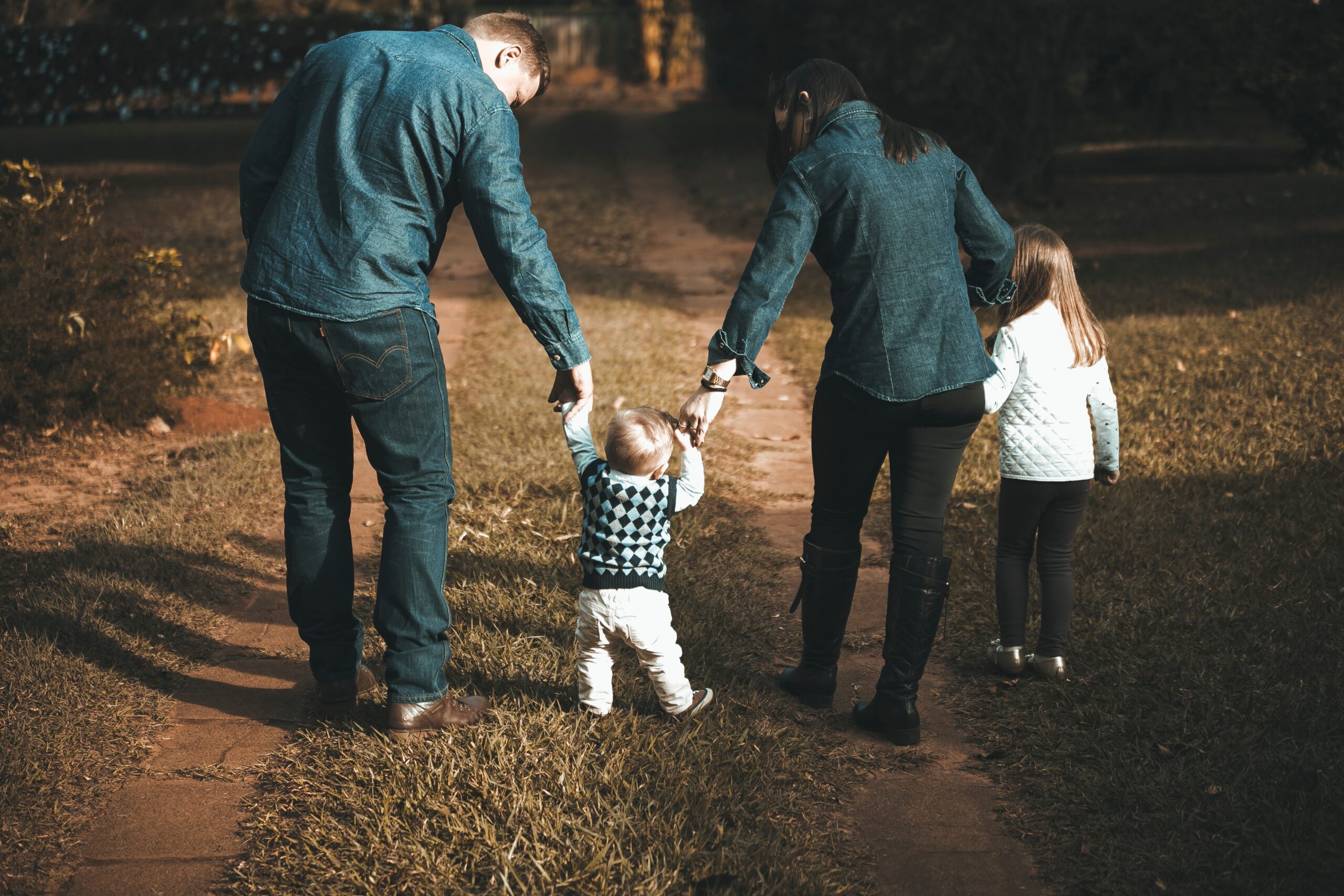 family walks with children hand in hand
